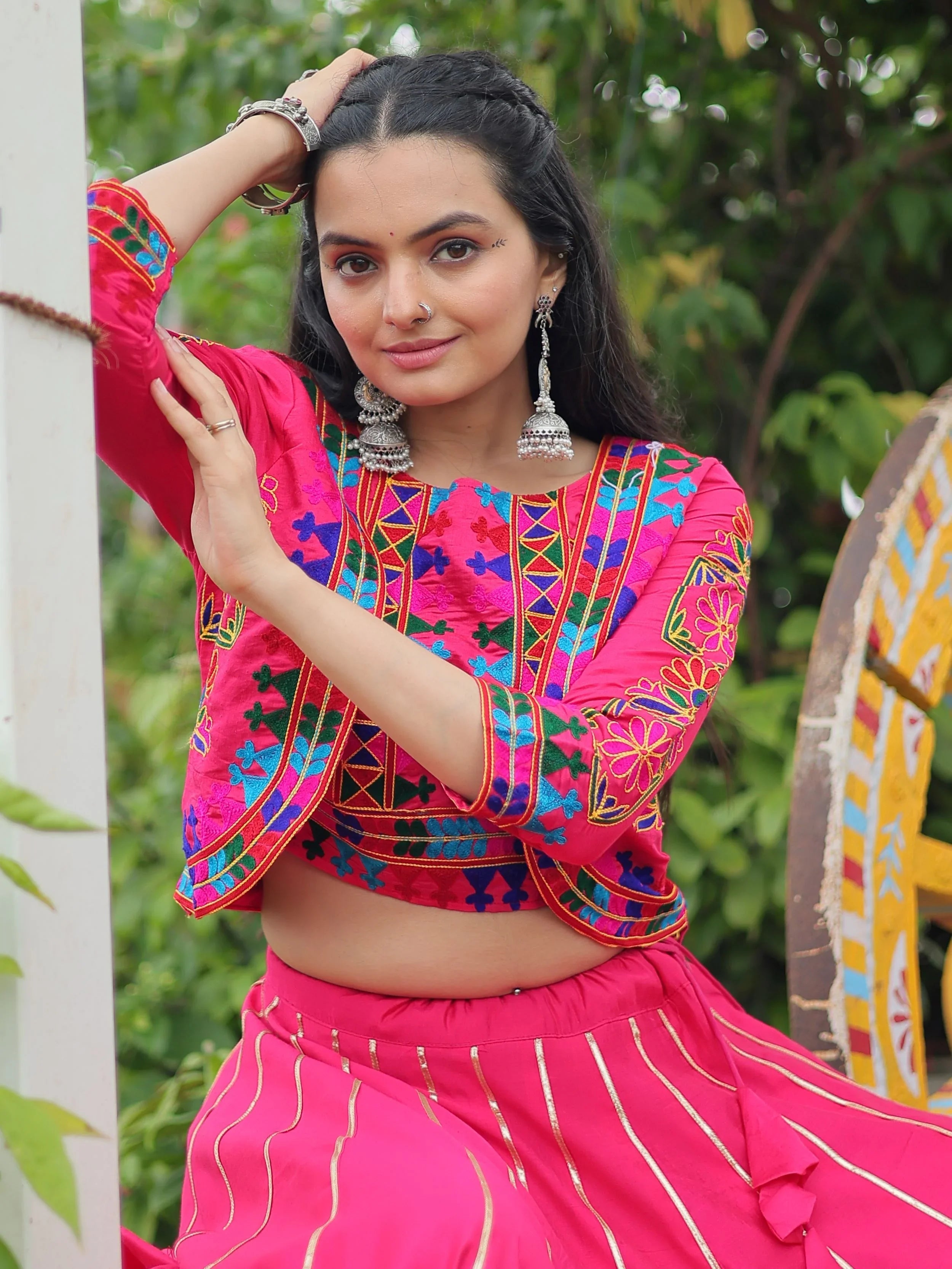 Pink lehenga choli with Kutchi Gamthi embroidery and Gota Patti lace