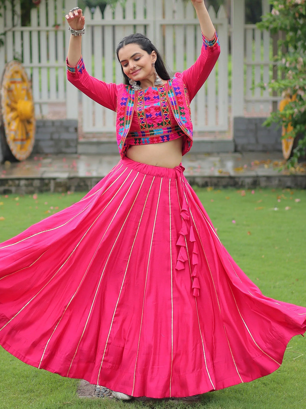 Pink lehenga choli with Kutchi Gamthi embroidery and Gota Patti lace