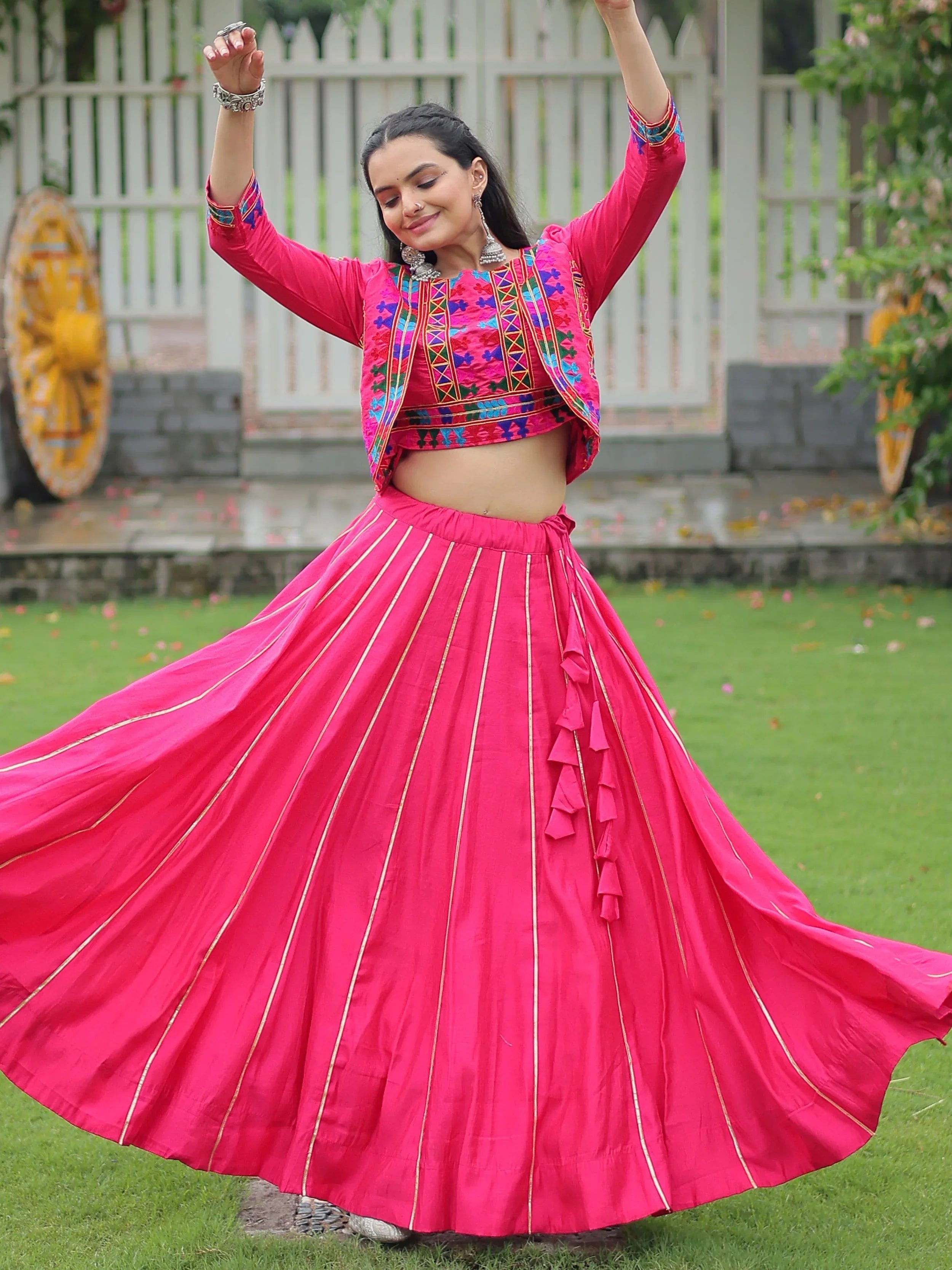 Pink lehenga choli with Kutchi Gamthi embroidery and Gota Patti lace