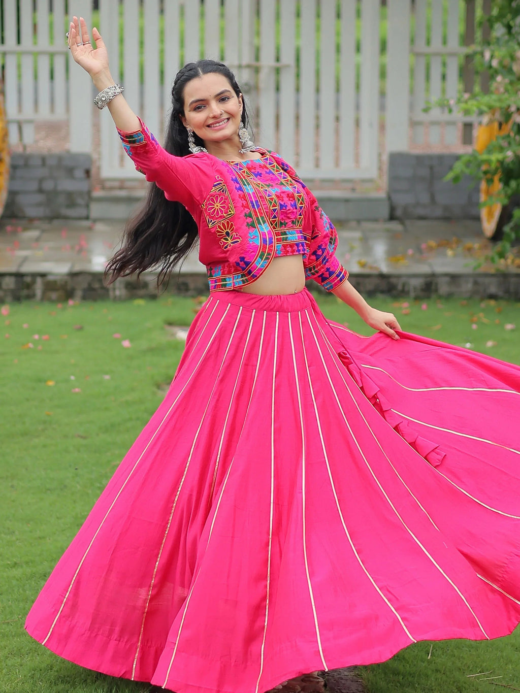 Pink lehenga choli with Kutchi Gamthi embroidery and Gota Patti lace