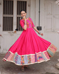 Pink silk gown with thread mirror embroidery and crochet print