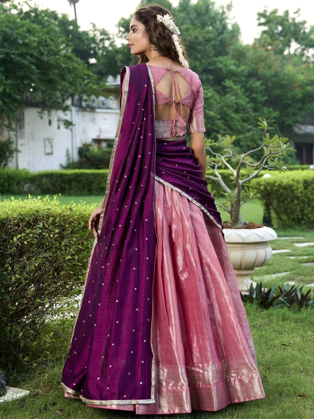 Pink kanchipuram silk lehenga choli with zari weaving and sequins embroidery