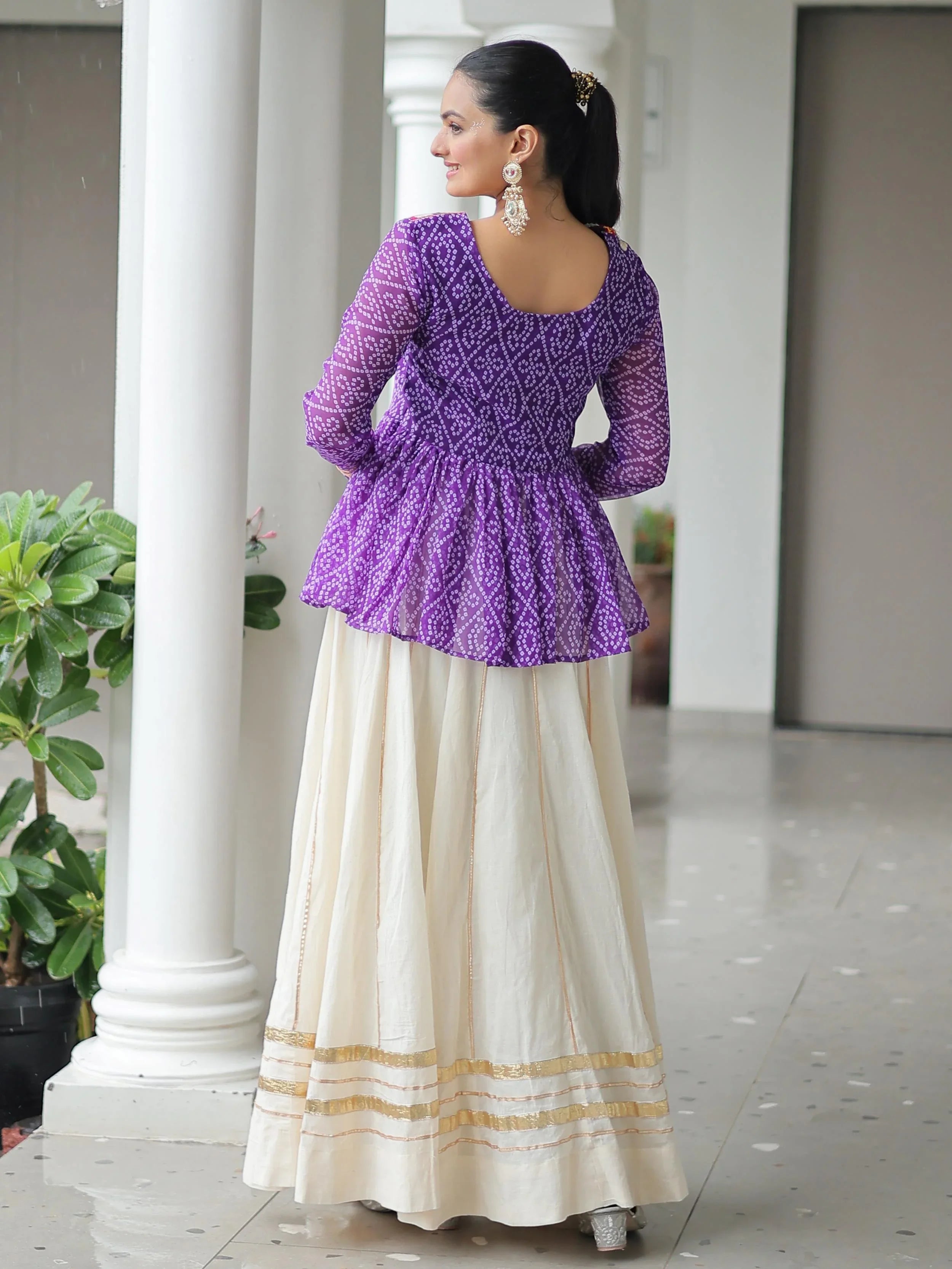 Elegant purple Kora cotton Navratri lehenga set with Bandhani print top and Gota Patti work