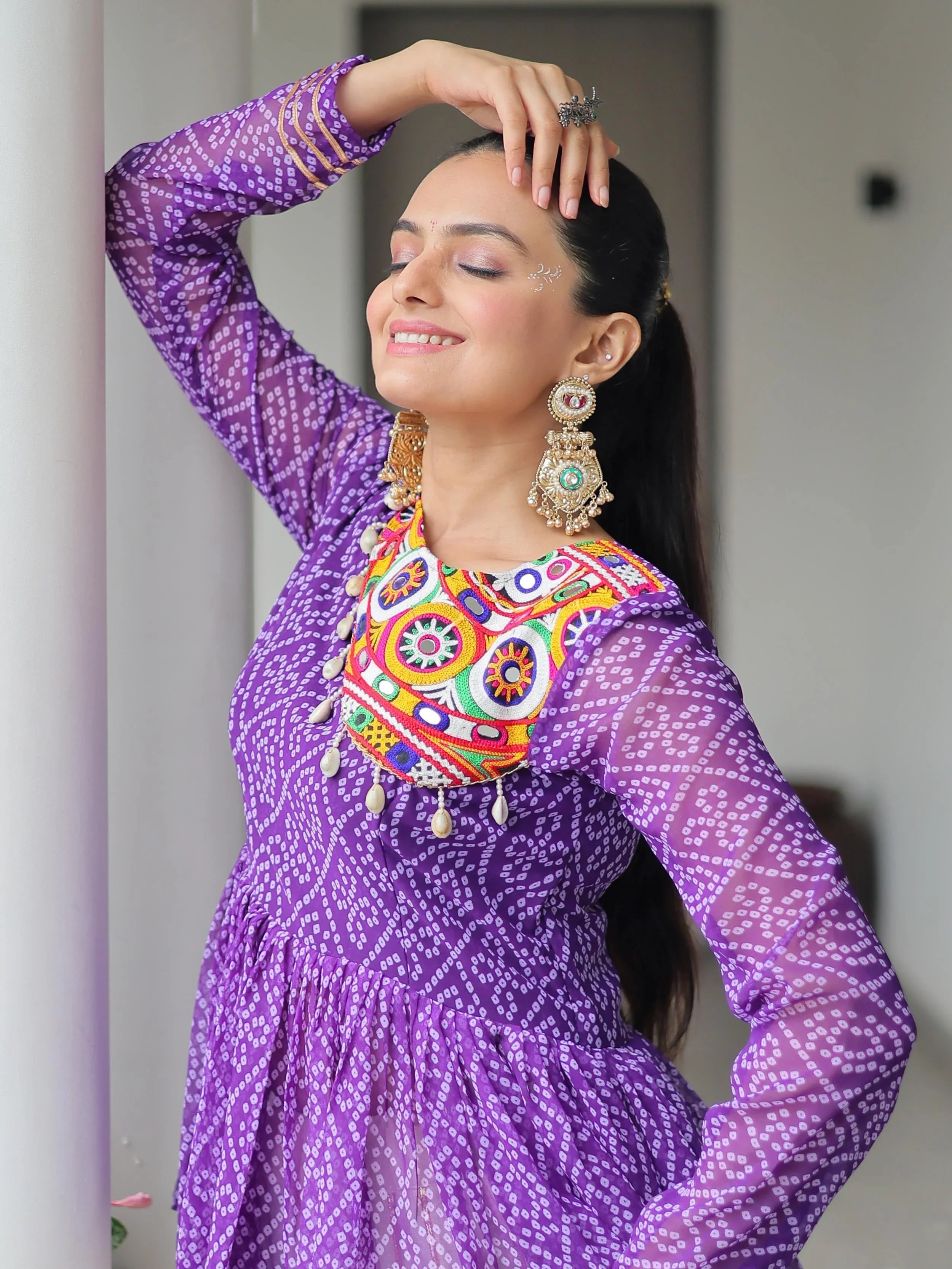 Elegant purple Kora cotton Navratri lehenga set with Bandhani print top and Gota Patti work