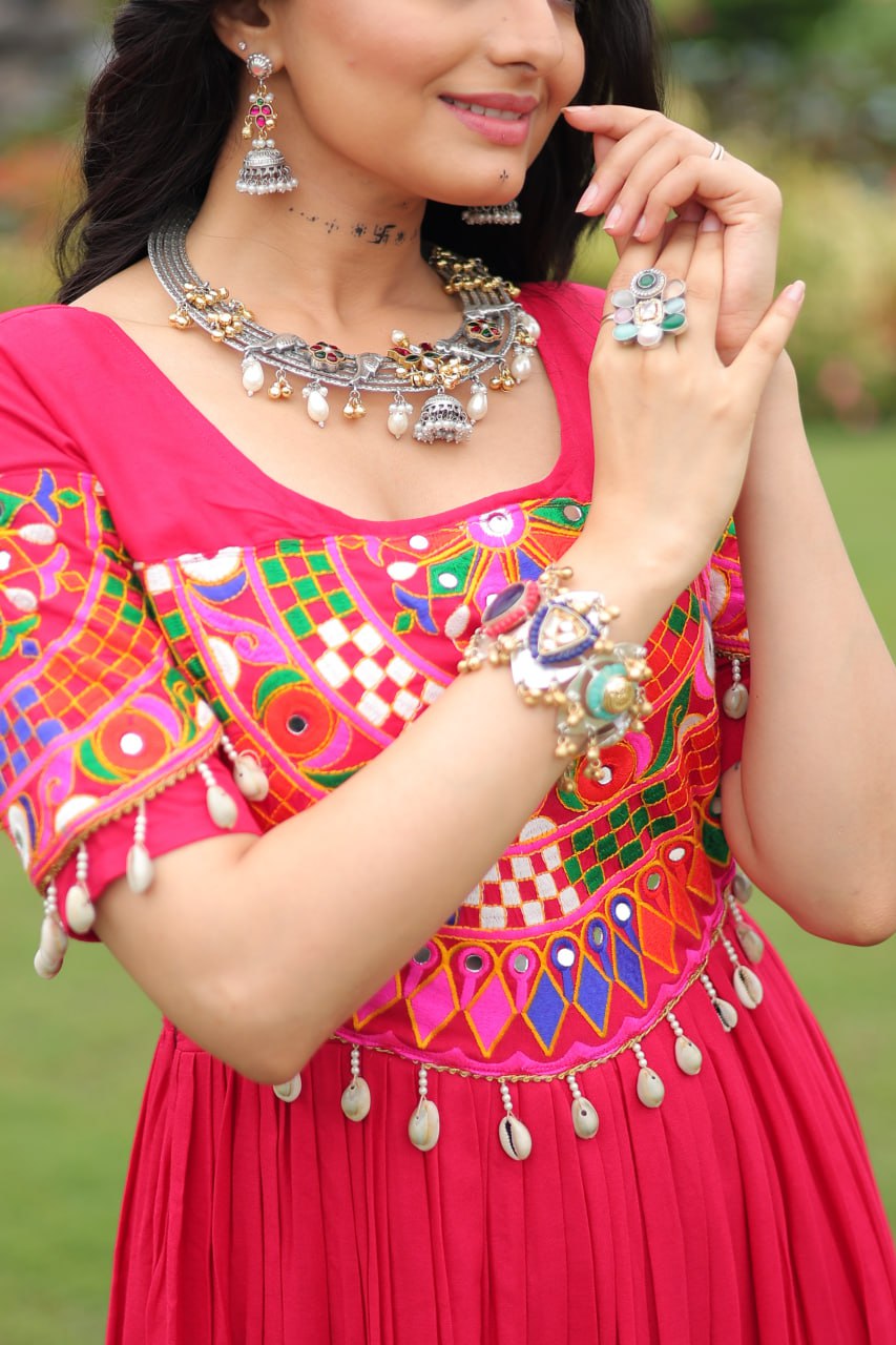 Rani pink pure rayon flair gown with kutchi gamthi embroidery for navratri