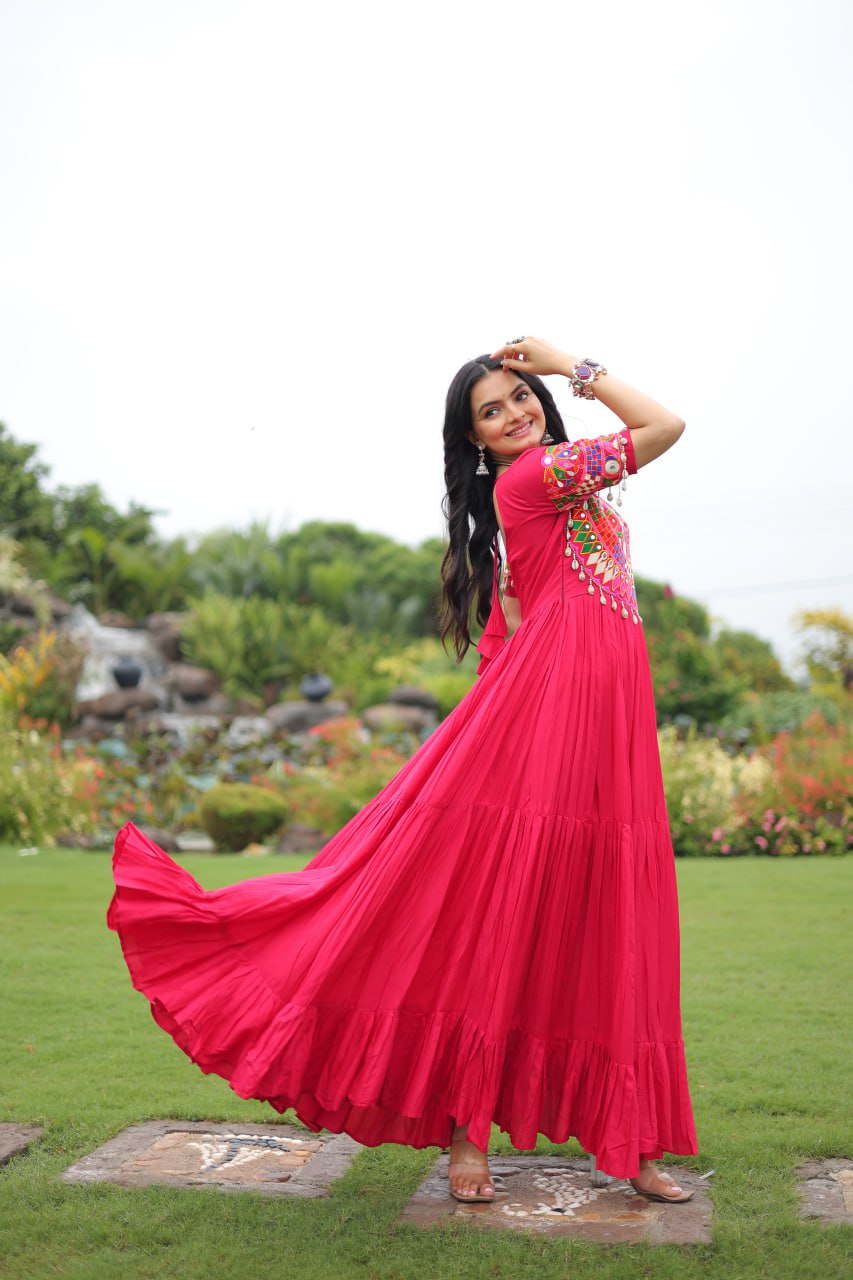 Rani pink pure rayon flair gown with kutchi gamthi embroidery for navratri