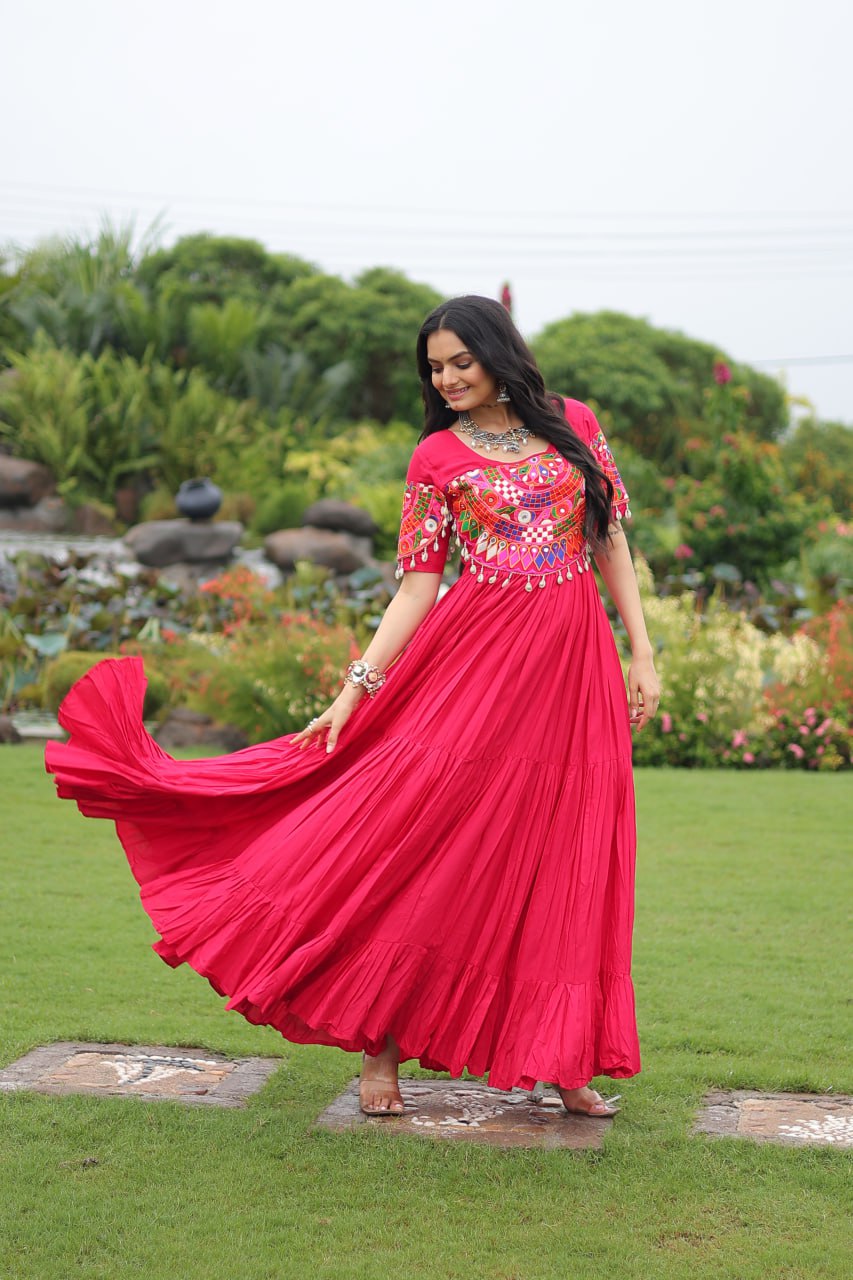 Rani pink pure rayon flair gown with kutchi gamthi embroidery for navratri