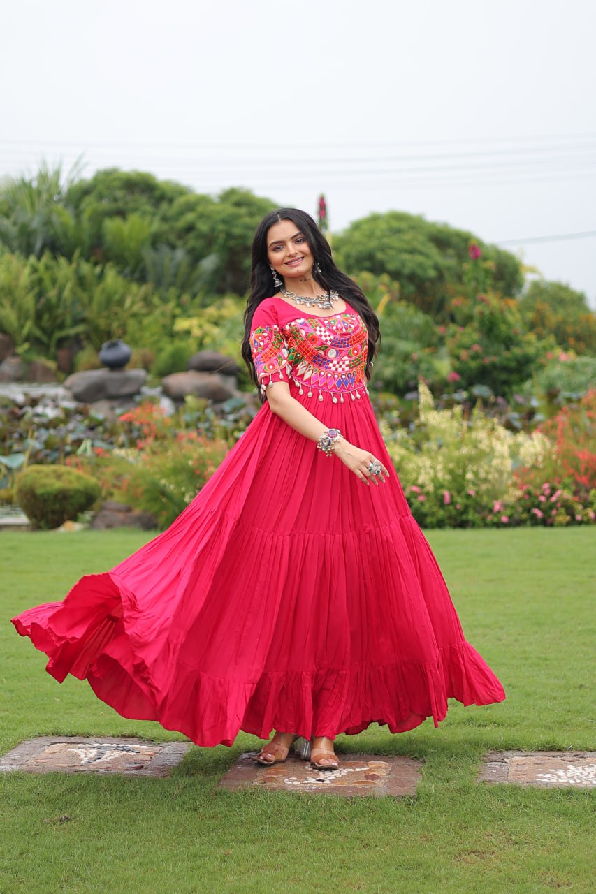Rani pink pure rayon flair gown with kutchi gamthi embroidery for navratri