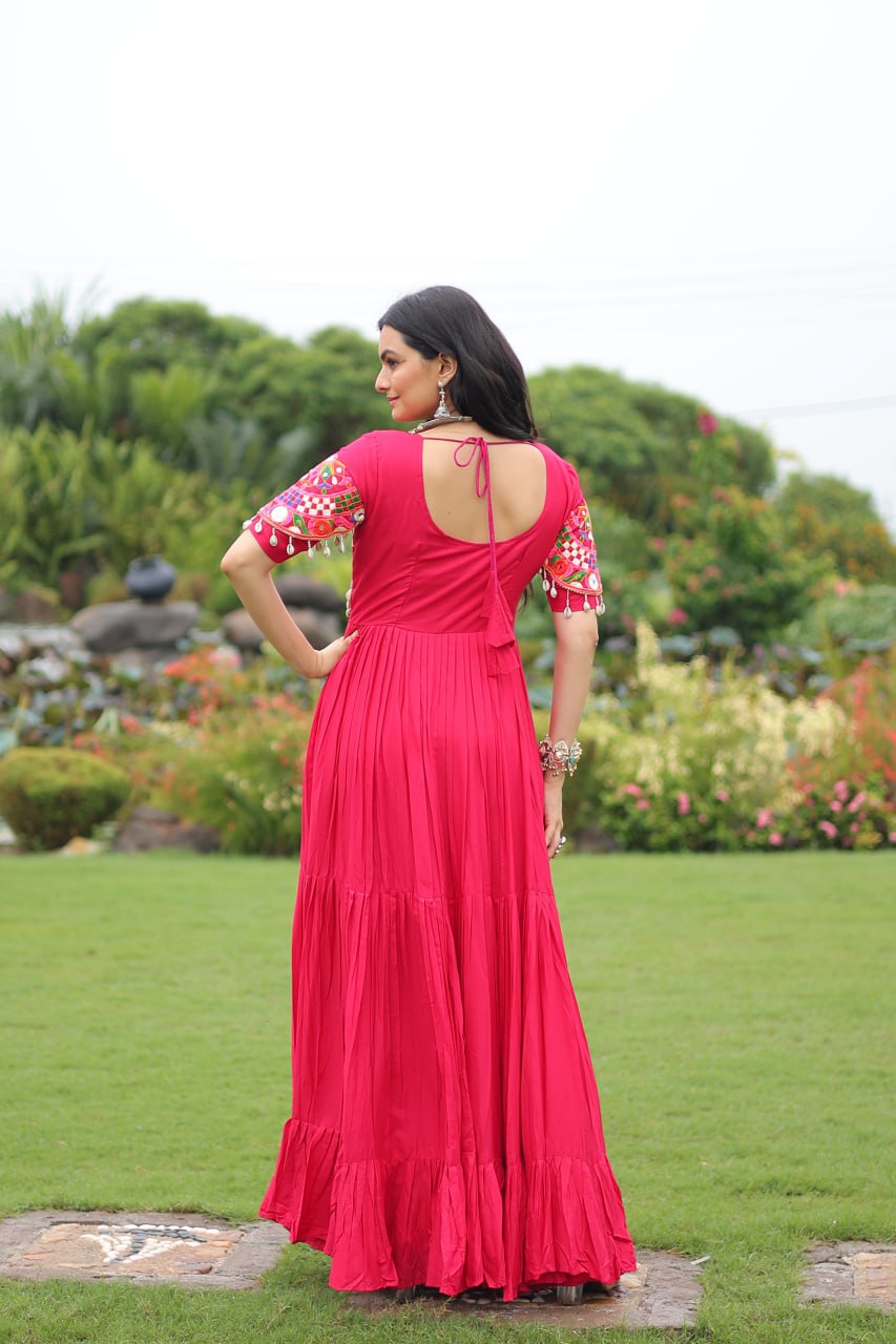 Rani pink pure rayon flair gown with kutchi gamthi embroidery for navratri