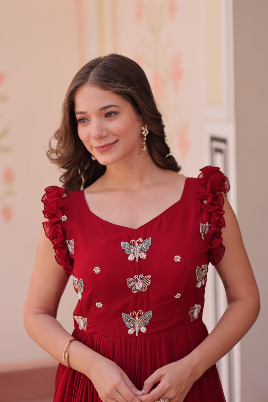 Lavi 7-meter flared designer gown in faux blooming fabric with sequin & bead embroidery, V-neck & frill shoulders – perfect for weddings & parties.