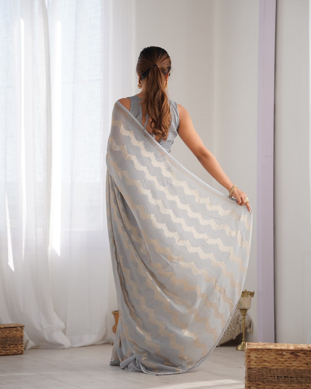 Graceful Aira Grey Georgette saree with heavy sequin embroidery and Seroski diamond embellishments, paired with an unstitched satin Banglori blouse – ideal bridal saree, festive saree, designer grey saree, elegant ethnic party wear, and luxury embroidered saree for women.