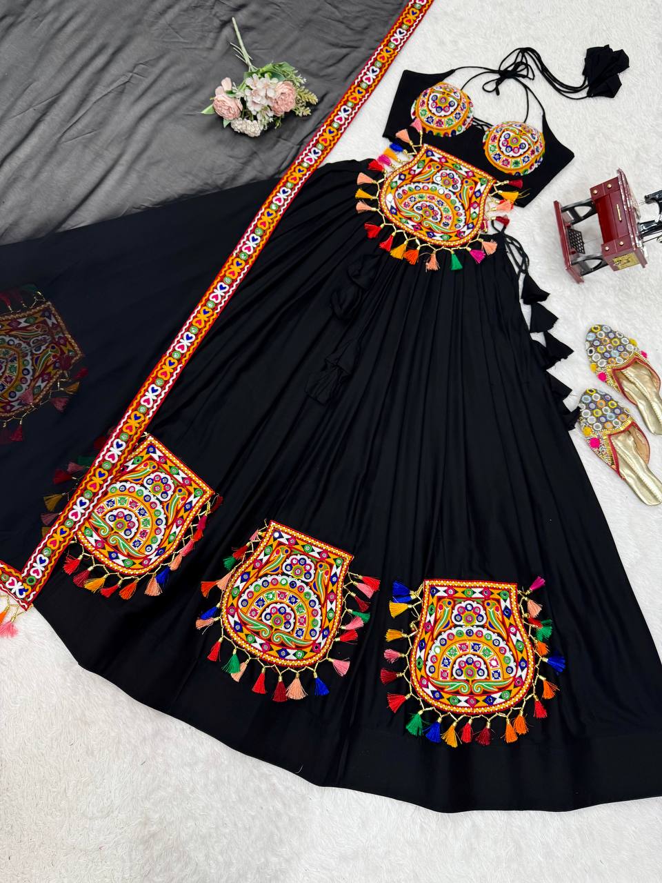 Black georgette lehenga choli with Gamthi embroidery and mirror work