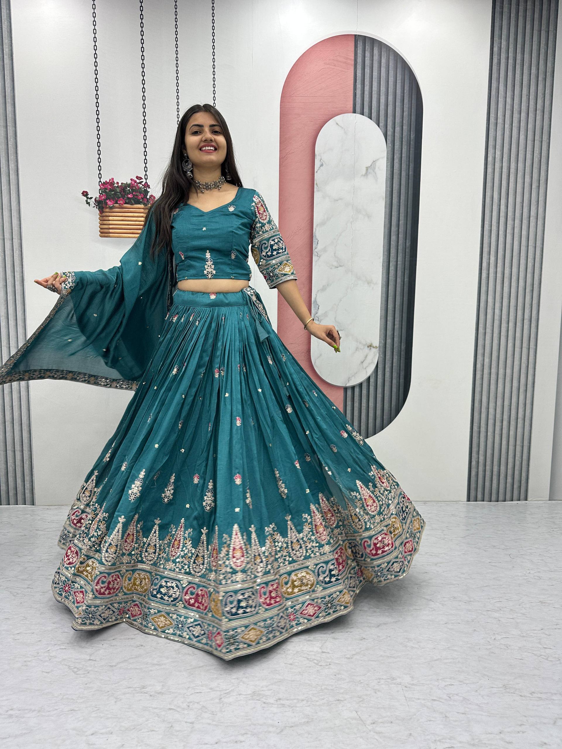 Raji teal green Vichitra silk lehenga choli with sequins thread embroidery and dupatta