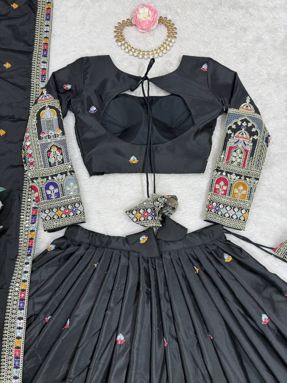 Kavyani Natural Crepe Silk Black Lehenga Choli Set – semi-stitched lehenga with 3-meter flair, cancan and canvas patta, intricately embroidered with coding dori, thread, and sequins; paired with unstitched matching choli and embroidered dupatta with lace border, premium festive and wedding ethnic wear for women by Trinaari.