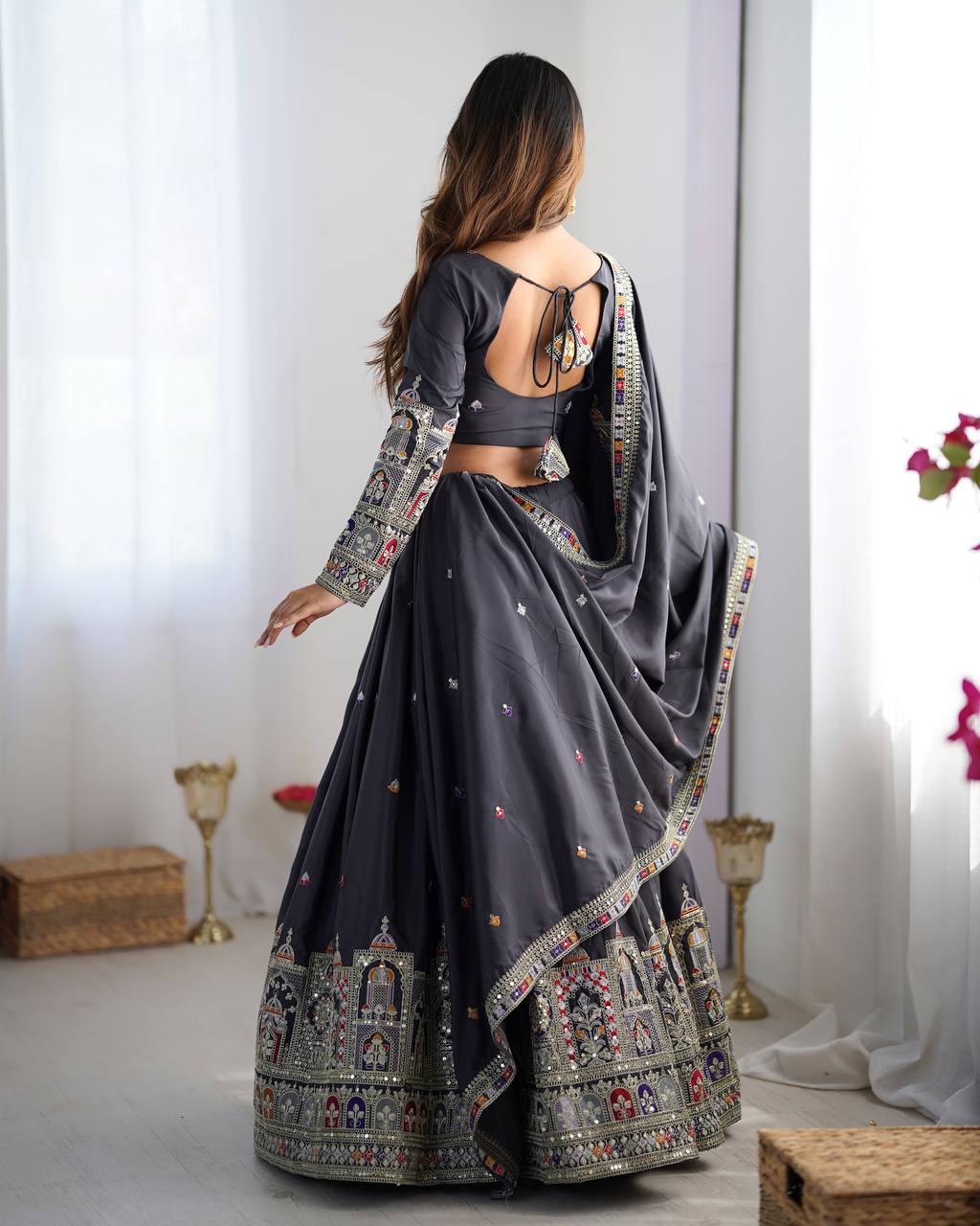 Kavyani Natural Crepe Silk Black Lehenga Choli Set – semi-stitched lehenga with 3-meter flair, cancan and canvas patta, intricately embroidered with coding dori, thread, and sequins; paired with unstitched matching choli and embroidered dupatta with lace border, premium festive and wedding ethnic wear for women by Trinaari.