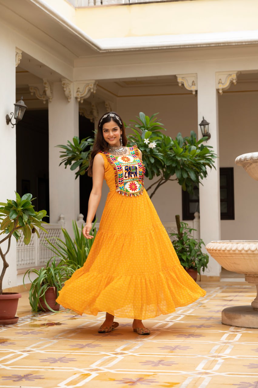 Yellow faux georgette Bandhani print Kutchi patch mirror work gown
