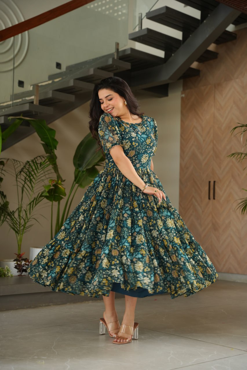  Vikarni Green Printed Anarkali Gown in faux georgette with 12-meter flair – perfect ethnic wear for women, long gown for women, printed gown for girls, Anarkali gown for wedding, georgette gown for festive wear, Indian dress for women, traditional wear for haldi ceremony, party wear gown online, readymade gown under 1000, stylish green ethnic gown for mehndi function.