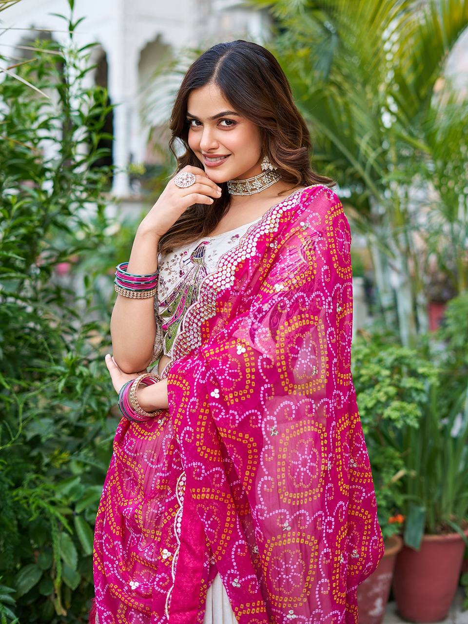 Amla off-white tissue silk lehenga choli with sequins thread work and pink Bandhej dupatta