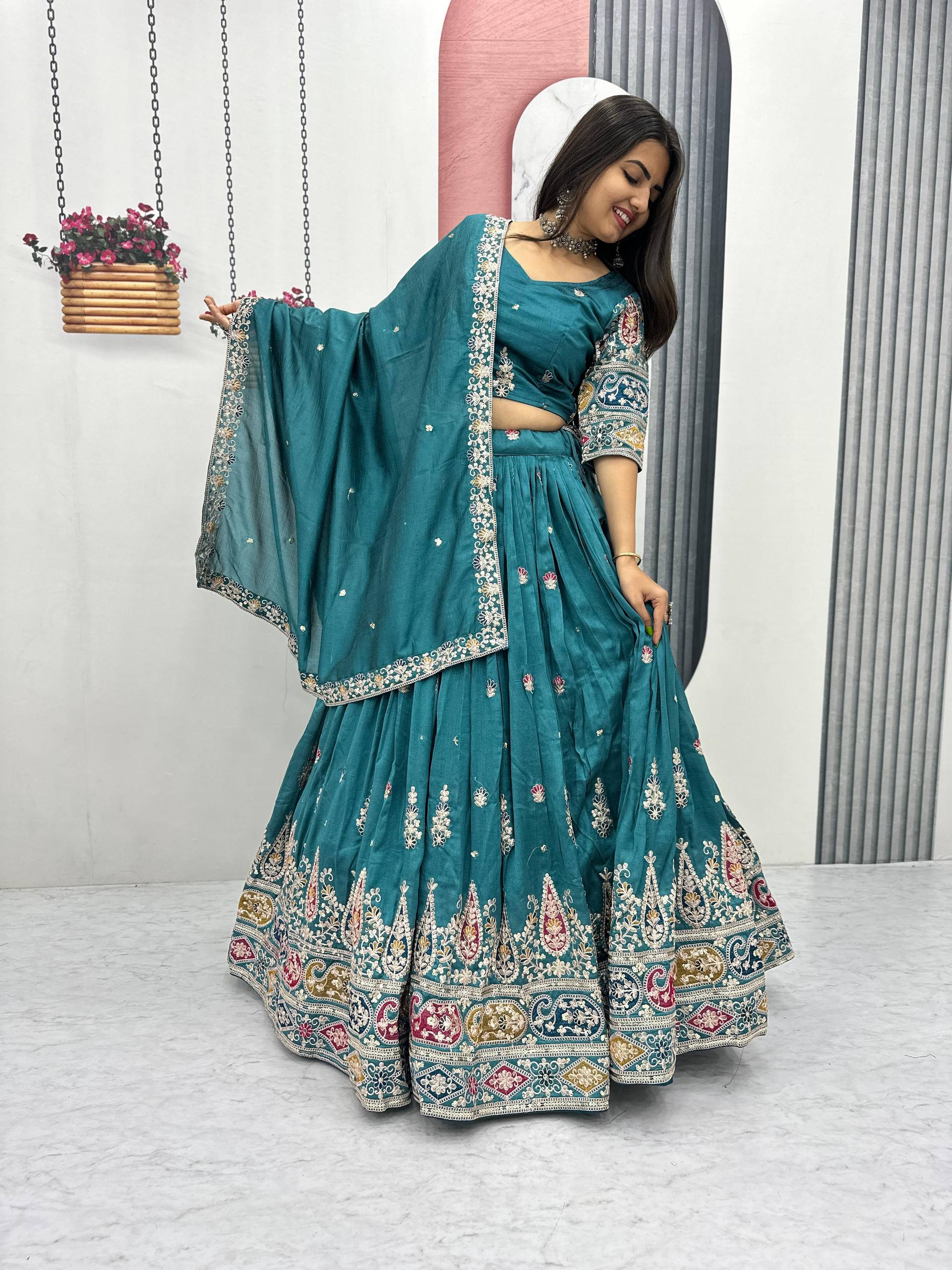 Raji teal green Vichitra silk lehenga choli with sequins thread embroidery and dupatta