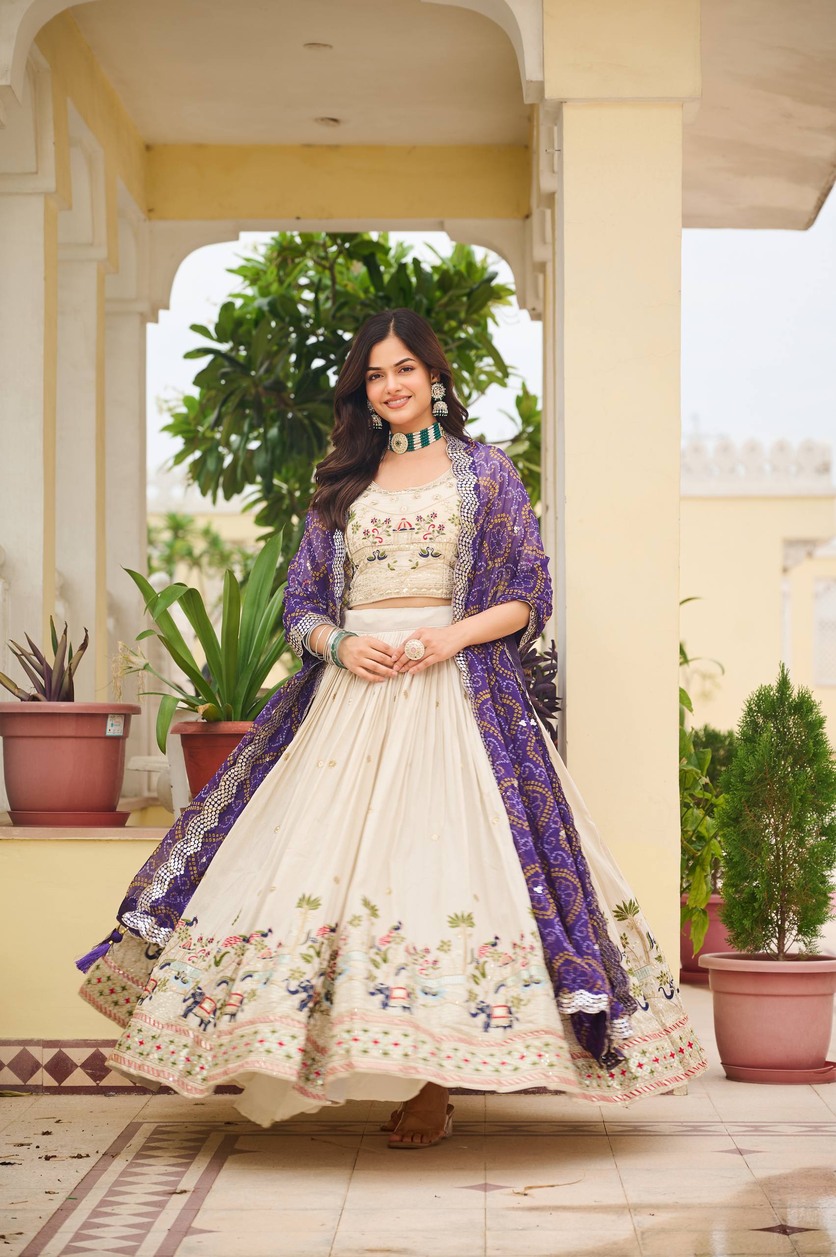 Off-white silk sequins thread embroidery lehenga choli with purple Bandhej dupatta