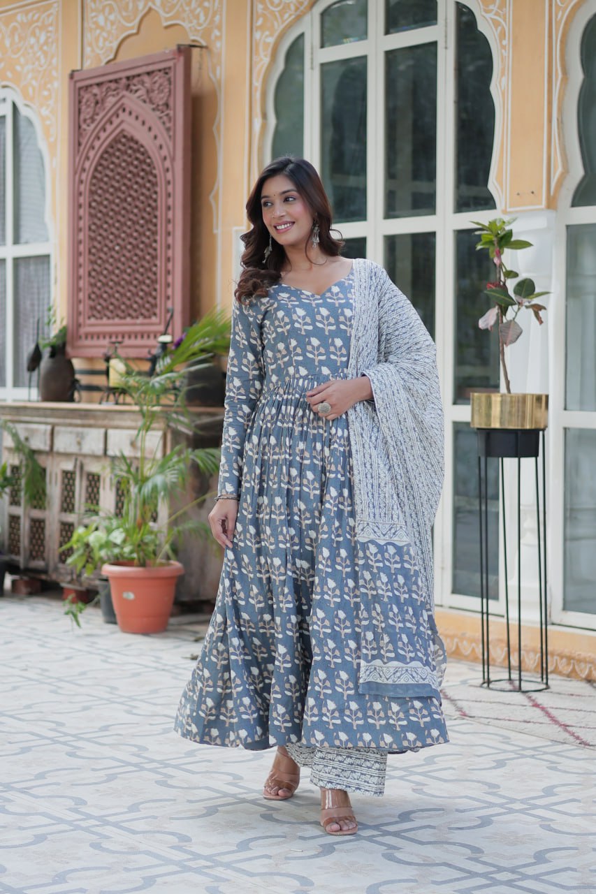The Ridhvini Orange Cotton Anarkali Set is a stylish and comfortable ethnic wear choice for women, crafted from premium pure cotton. This readymade Anarkali suit set features a long Anarkali kurti with a fancy V-neck and full sleeves, paired with breathable cotton straight pants and a matching cotton dupatta. Ideal for daily wear, office wear, and festive occasions, this lightweight Anarkali cotton kurta set is designed for effortless elegance. Whether you're looking for a casual cotton suit, summer ethnic 
