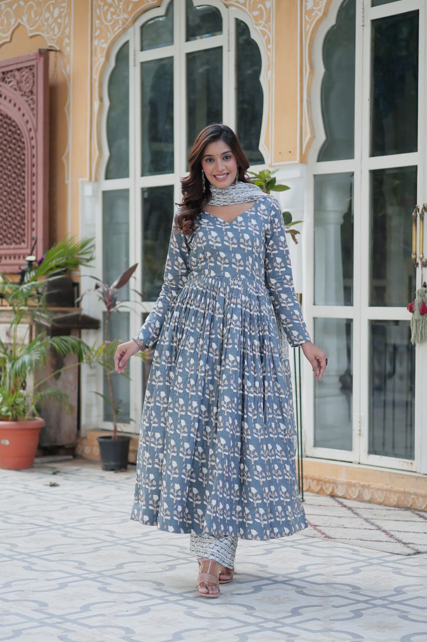 The Ridhvini Orange Cotton Anarkali Set is a stylish and comfortable ethnic wear choice for women, crafted from premium pure cotton. This readymade Anarkali suit set features a long Anarkali kurti with a fancy V-neck and full sleeves, paired with breathable cotton straight pants and a matching cotton dupatta. Ideal for daily wear, office wear, and festive occasions, this lightweight Anarkali cotton kurta set is designed for effortless elegance. Whether you're looking for a casual cotton suit, summer ethnic 