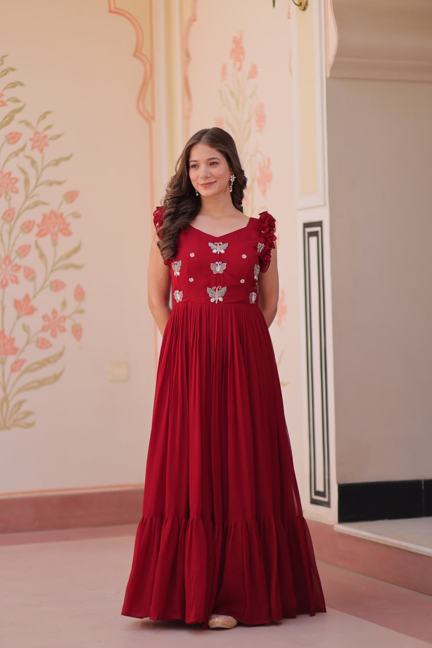 Lavi 7-meter flared designer gown in faux blooming fabric with sequin & bead embroidery, V-neck & frill shoulders – perfect for weddings & parties.