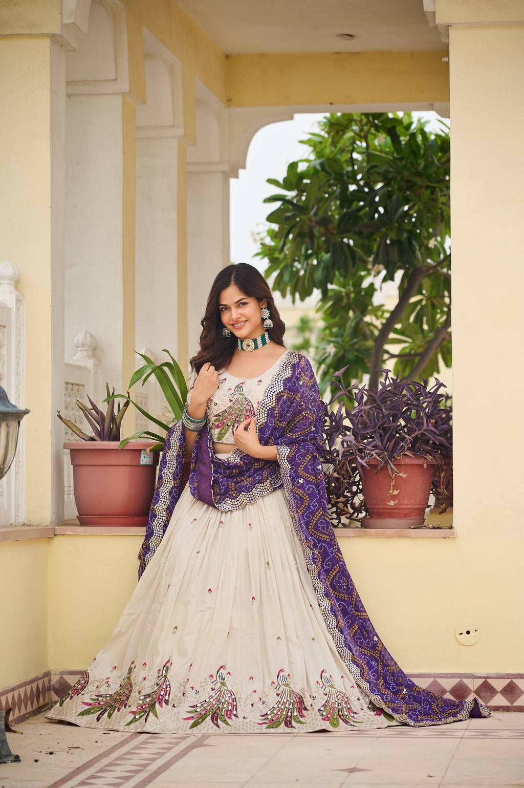 Amla off-white tissue silk lehenga choli with sequins thread work and purple Bandhej dupatta