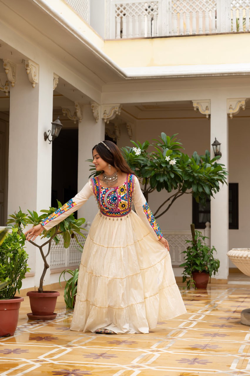 Off-white cotton gown with Kutchi Gamthi mirror embroidery and lace