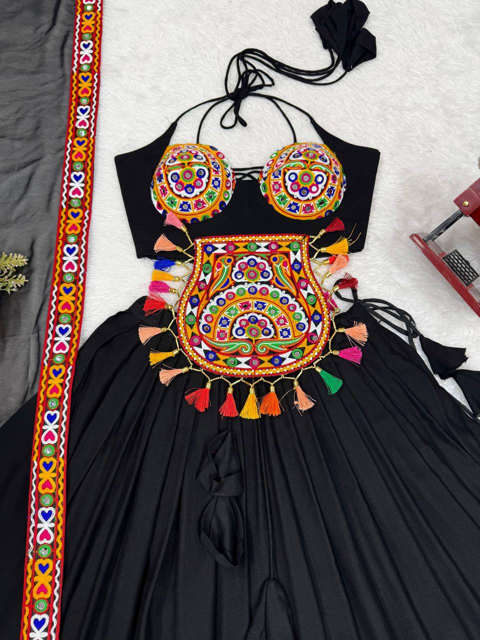 Black georgette lehenga choli with Gamthi embroidery and mirror work