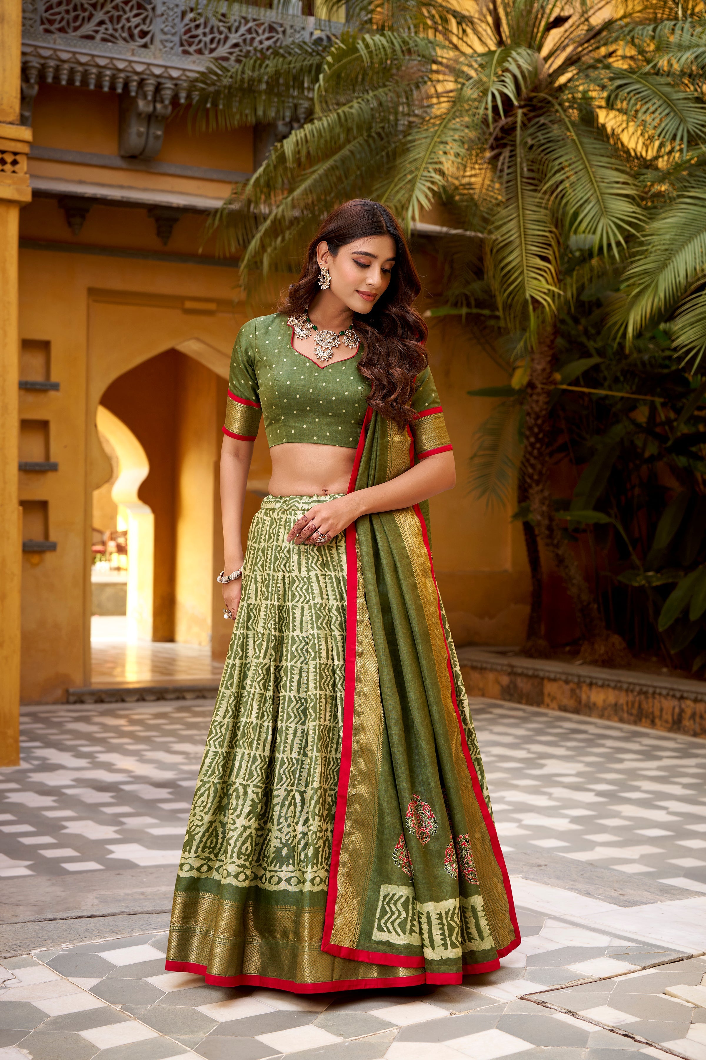 Girija mehendi green Dola silk batik print lehenga choli with zari weaving work