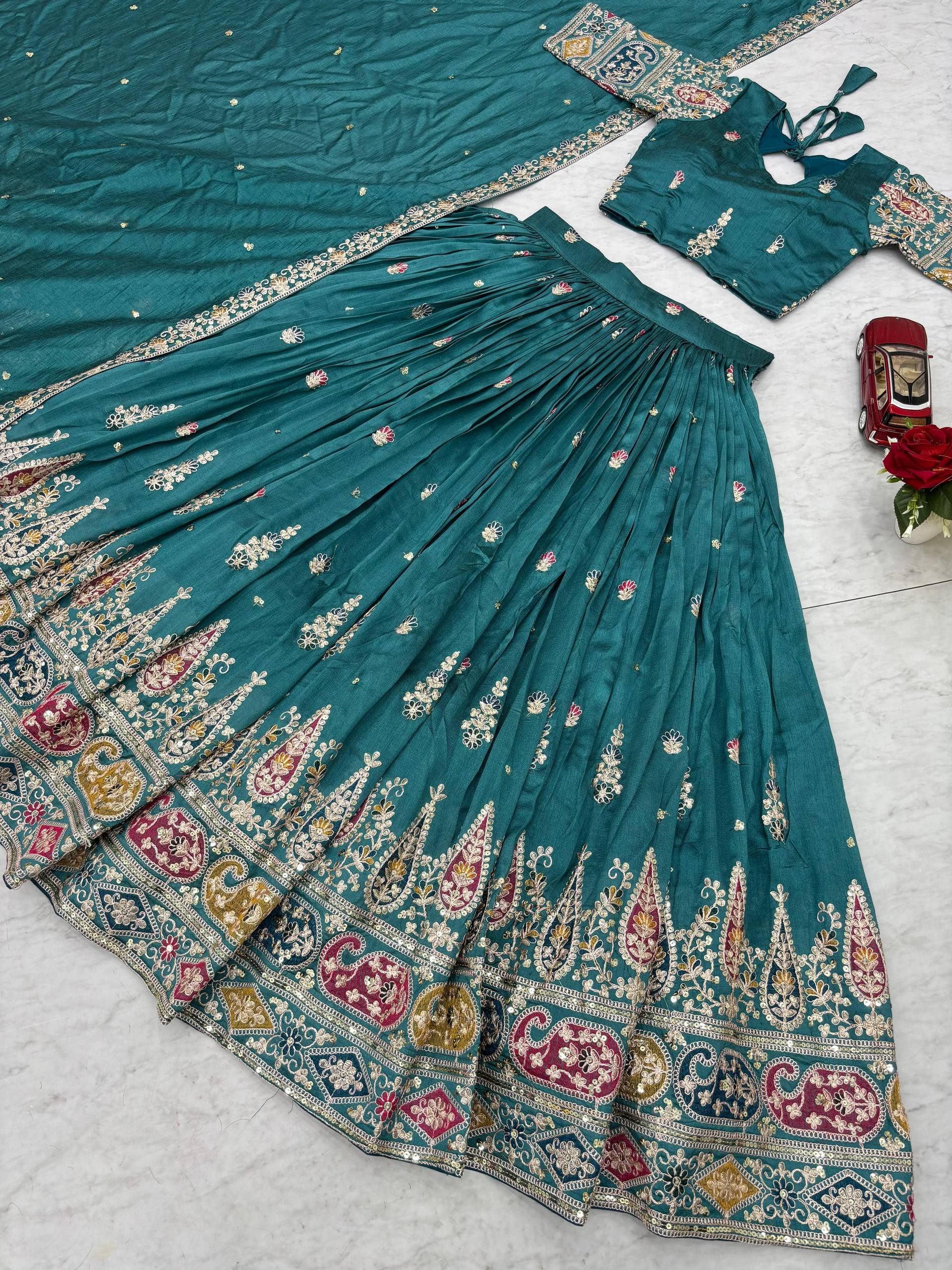 Raji teal green Vichitra silk lehenga choli with sequins thread embroidery and dupatta