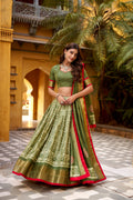 Girija mehendi green Dola silk batik print lehenga choli with zari weaving work