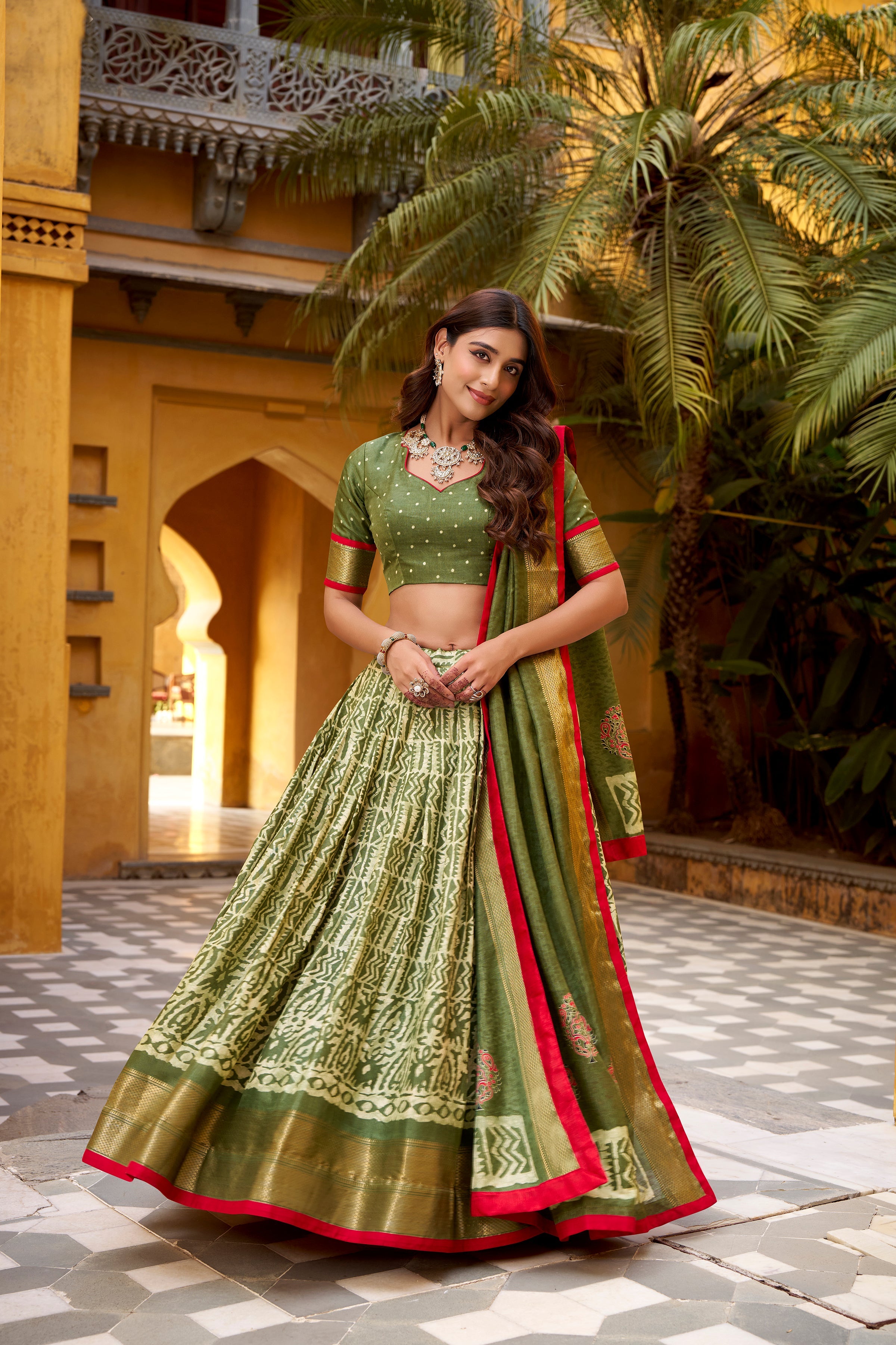 Girija mehendi green Dola silk batik print lehenga choli with zari weaving work