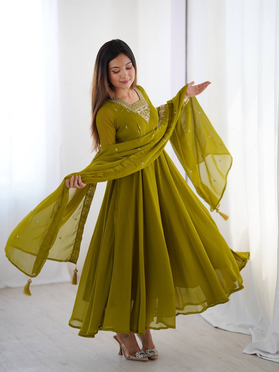 Green Anarkali suit in soft Fox Georgette with 6.5-meter flair, beads & zari embroidery, lace sleeves & dupatta – fully stitched & party-ready.
