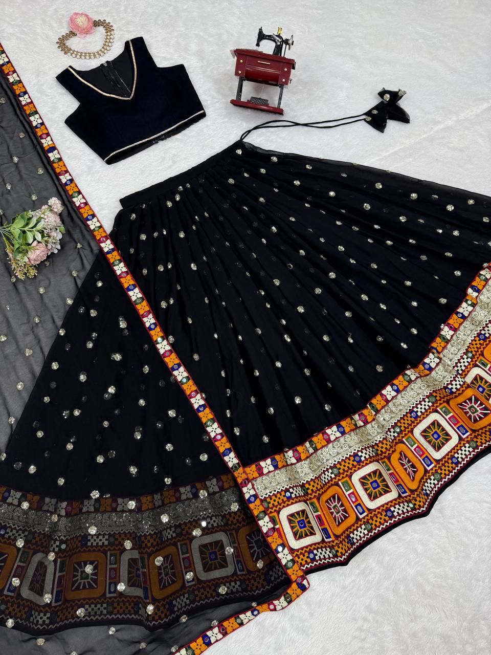 Black georgette lehenga choli with Gamthi embroidery and mirror work