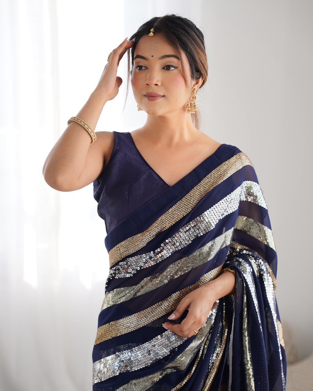 Deep blue georgette sequin embroidered Kira designer saree