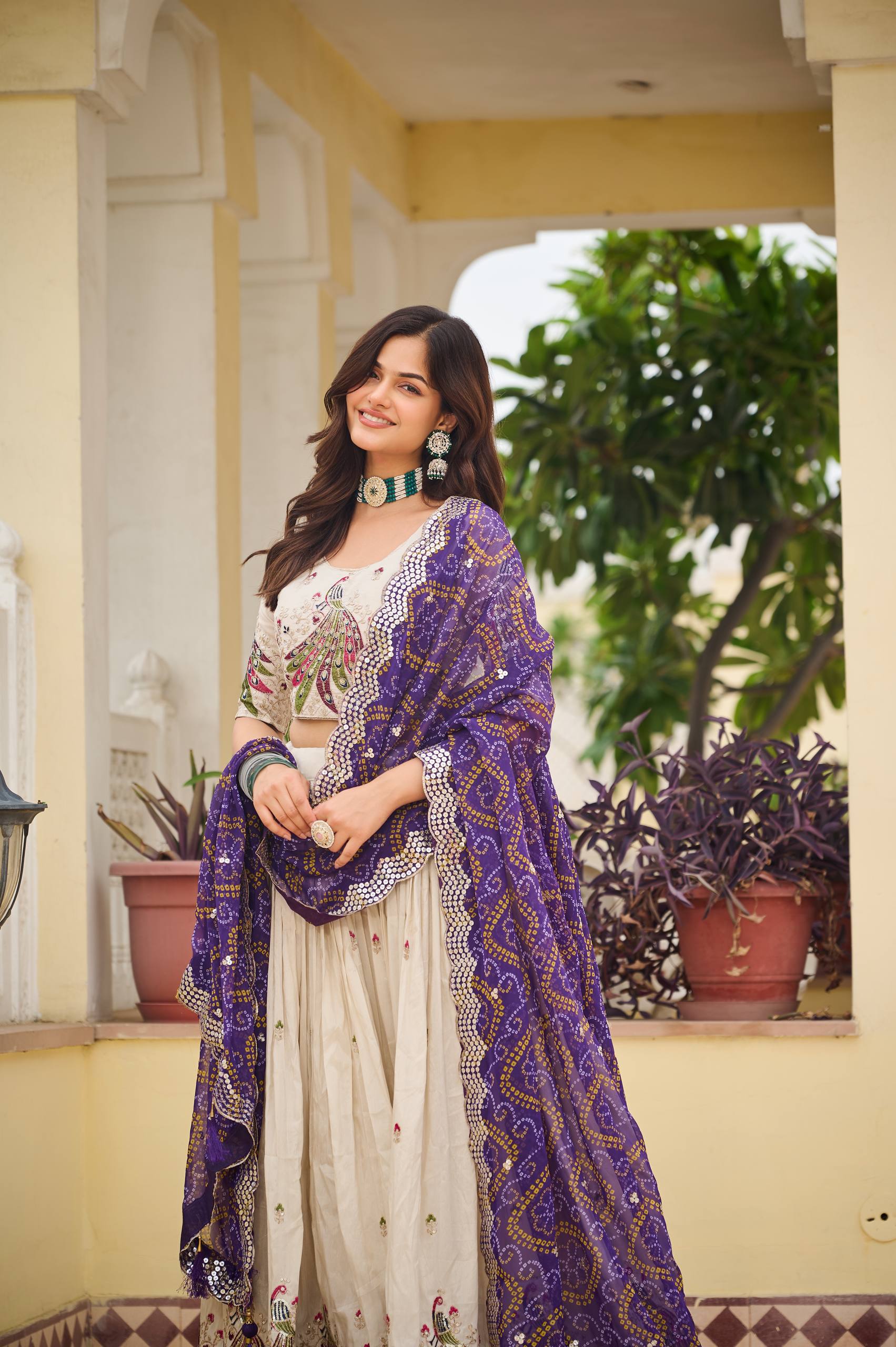 Amla off-white tissue silk lehenga choli with sequins thread work and purple Bandhej dupatta