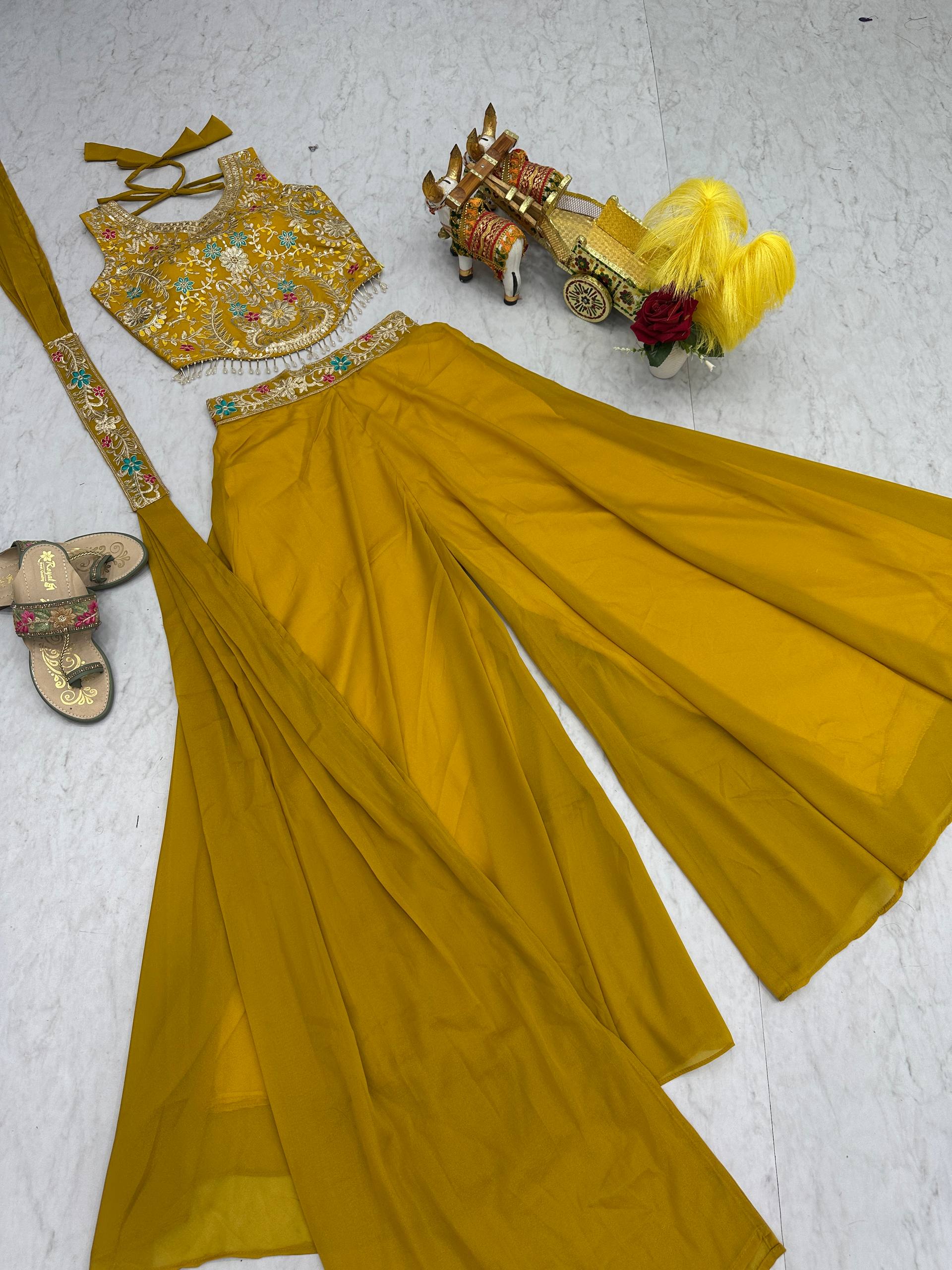 Stuti mustard yellow star georgette top palazzo set with sequins thread embroidery