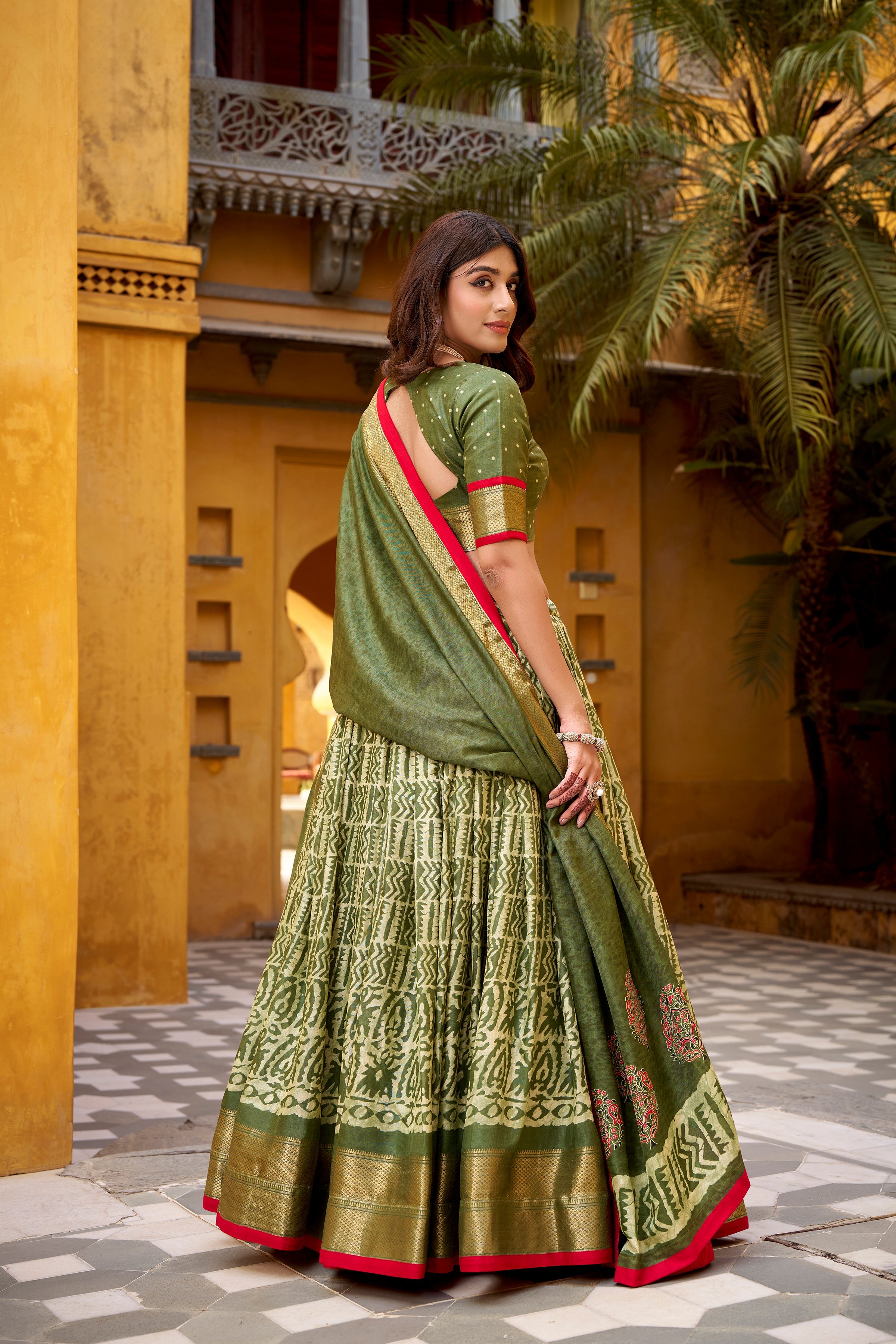 Girija mehendi green Dola silk batik print lehenga choli with zari weaving work