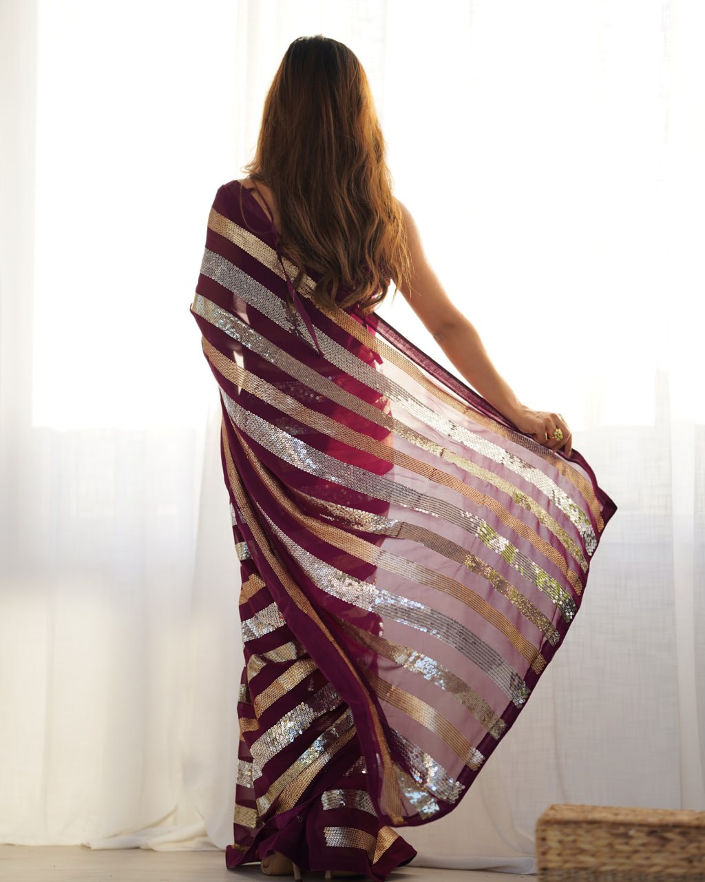 Kira Wine Georgette Saree with 3MM to 7MM sequin embroidery, elegant lining pattern and mono Banglory blouse – ideal sequin saree for wedding receptions, cocktail parties, festive wear, and premium Bollywood-style designer look.