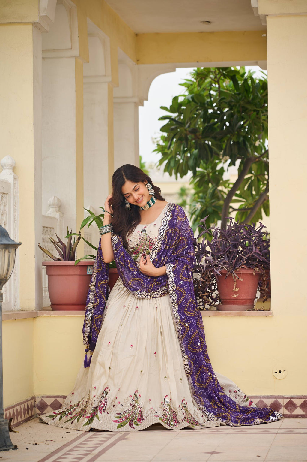 Amla off-white tissue silk lehenga choli with sequins thread work and purple Bandhej dupatta