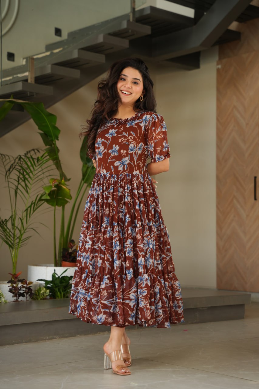 Vikarni Brown Printed Anarkali Gown in faux georgette with 12-meter flair & cotton lining – perfect for haldi, mehndi, festive & Indo-western occasions.
