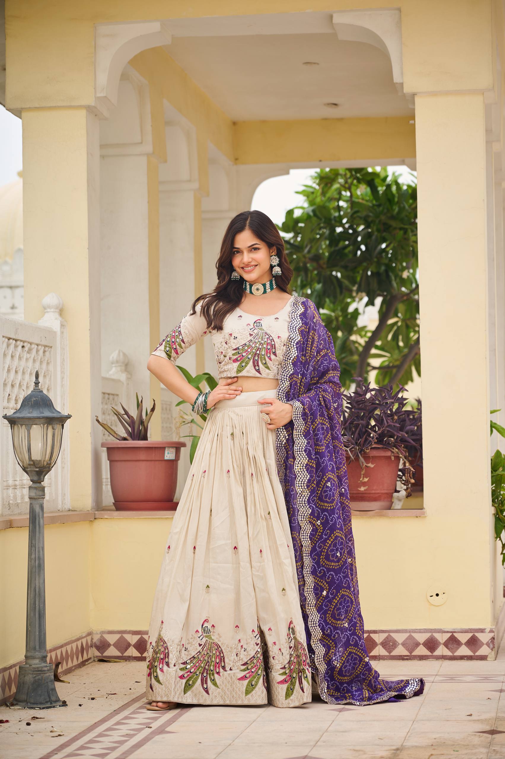 Amla off-white tissue silk lehenga choli with sequins thread work and purple Bandhej dupatta