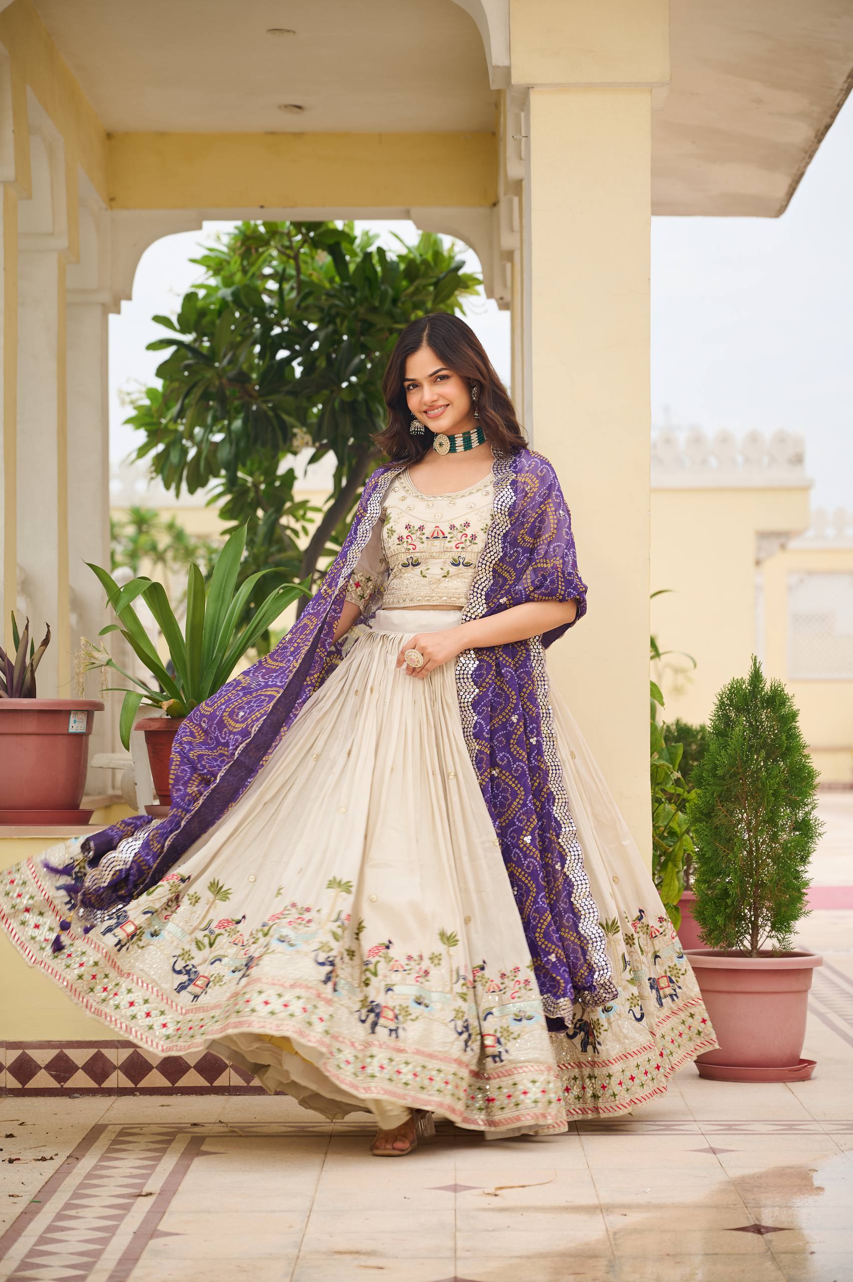 Off-white silk sequins thread embroidery lehenga choli with purple Bandhej dupatta