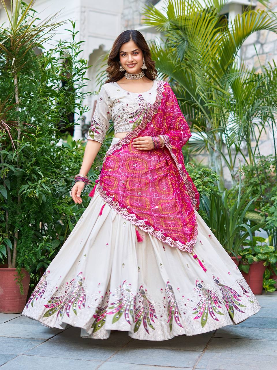 Amla off-white tissue silk lehenga choli with sequins thread work and pink Bandhej dupatta