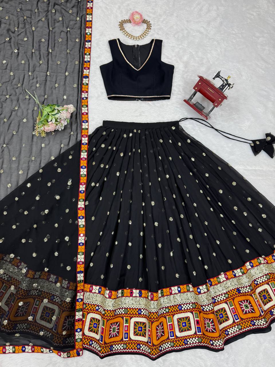 Black georgette lehenga choli with Gamthi embroidery and mirror work