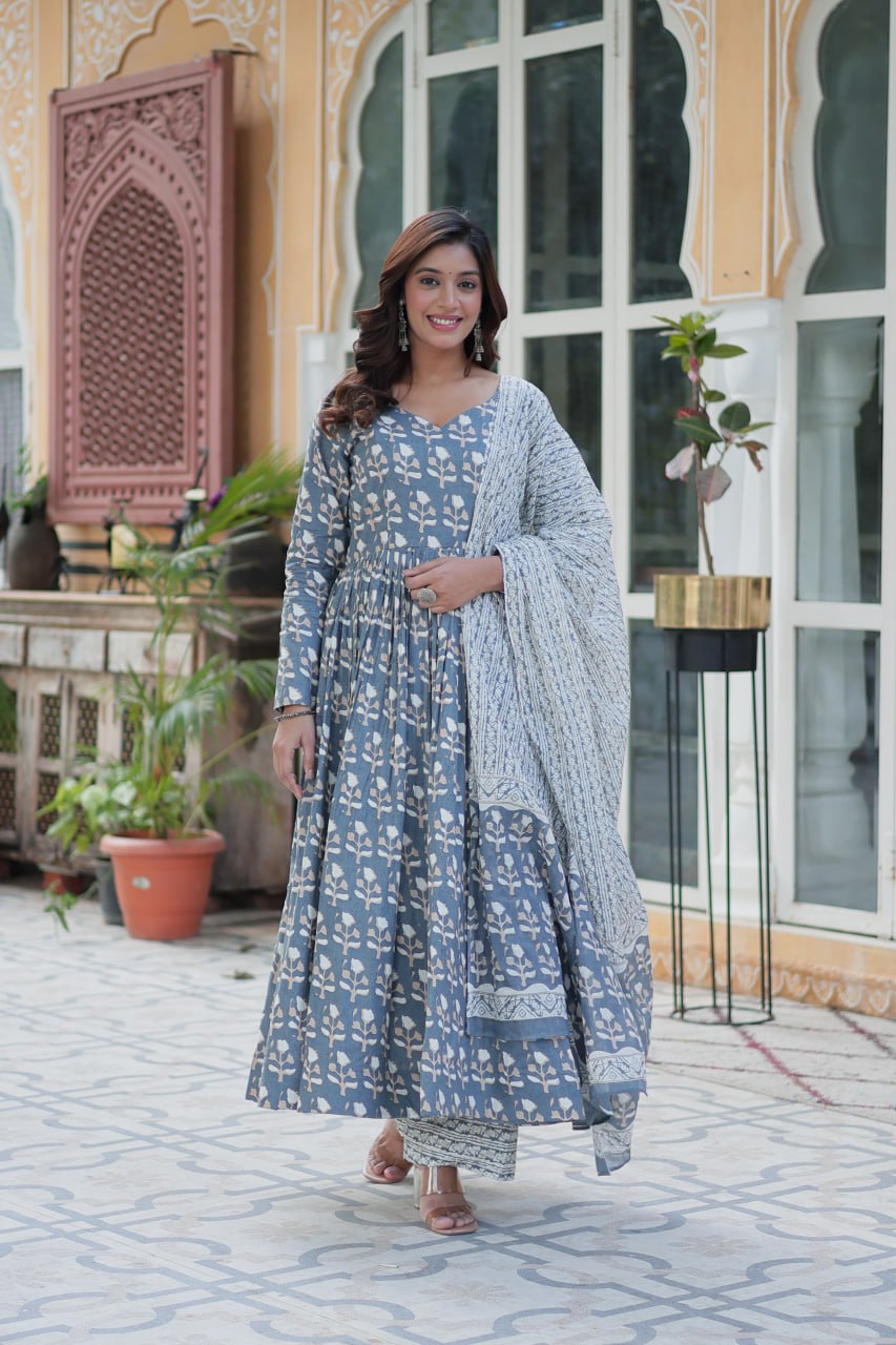 The Ridhvini Orange Cotton Anarkali Set is a stylish and comfortable ethnic wear choice for women, crafted from premium pure cotton. This readymade Anarkali suit set features a long Anarkali kurti with a fancy V-neck and full sleeves, paired with breathable cotton straight pants and a matching cotton dupatta. Ideal for daily wear, office wear, and festive occasions, this lightweight Anarkali cotton kurta set is designed for effortless elegance. Whether you're looking for a casual cotton suit, summer ethnic 