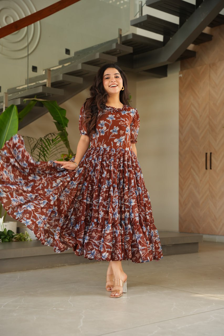 Vikarni Brown Printed Anarkali Gown in faux georgette with 12-meter flair & cotton lining – perfect for haldi, mehndi, festive & Indo-western occasions.
