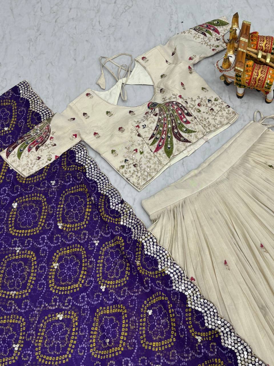 Amla off-white tissue silk lehenga choli with sequins thread work and purple Bandhej dupatta